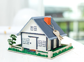 real estate with house model keys